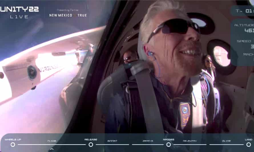 Billionaire Richard Branson smiles on board Virgin Galactic’s passenger rocket plane VSS Unity