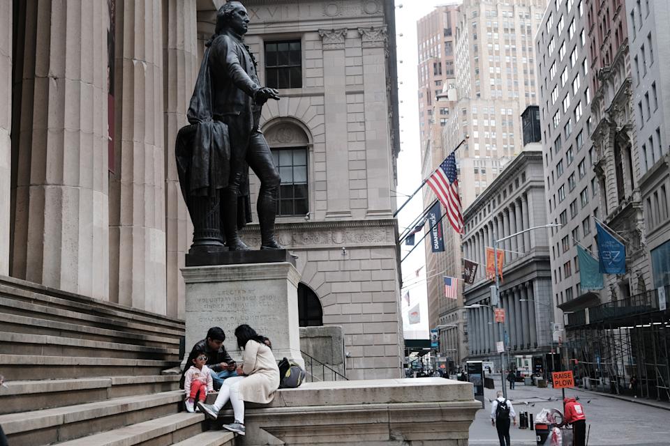 NEW YORK, NEW YORK - MAY 11: A family eats beside the New York Stock Exchange in lower Manhattan after global stocks fell as concerns mount that rising inflation will prompt central banks to tighten monetary policy on May 11, 2021 in New York City. By mid afternoon the tech-heavy Nasdaq Composite had lost 0.6% after falling 2.2% at its session low.  (Photo by Spencer Platt/Getty Images)